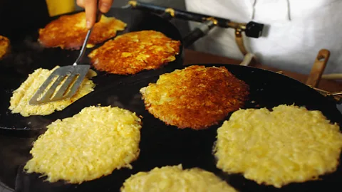 Owen Franken/Getty Images Potato pancakes called ‘latkes’ are a staple in Jewish cooking (Credit: Owen Franken/Getty Images)