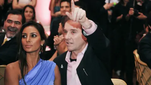 Getty Images Eike Batista with girlfriend Flavia Sampaio