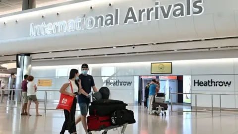 Getty Images Passengers arrive at London Heathrow airport