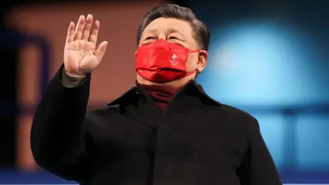 Getty Images China's President Xi Jinping waves during the closing ceremony of the Beijing 2022 Winter Olympic Games, at the National Stadium, known as the Bird's Nest, on February 20, 2022 in Beijing, China.