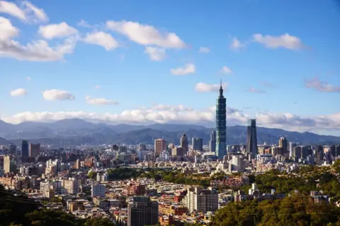 Getty Images Taipei 101 and the nearby Nanshan Plaza dominate Taipei's skyline when viewed from the south of the city. (