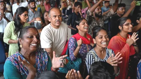 Getty Images People celebrate the successful lunar landing of Chandrayaan-3 spacecraft on the south pole of the Moon, in Chennai on August 23, 2023