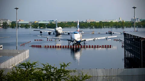 A flooded tarmac in Bangkok. Airports in New York also flooded after Hurricane Sandy in 2012 and it took days to get them fully operational again. (Getty Images)