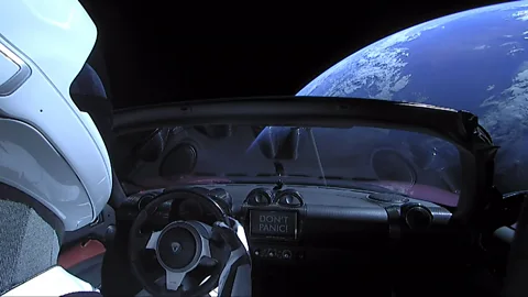 Getty Images Elon Musk etched Isaac Asimov sci-fi novels in glass in the glove compartment of the Tesla car launched with the Space X Falcon Heavy rocket (Credit: Getty Images)
